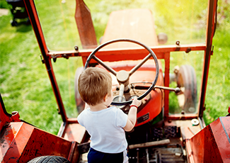 child driving a tractor