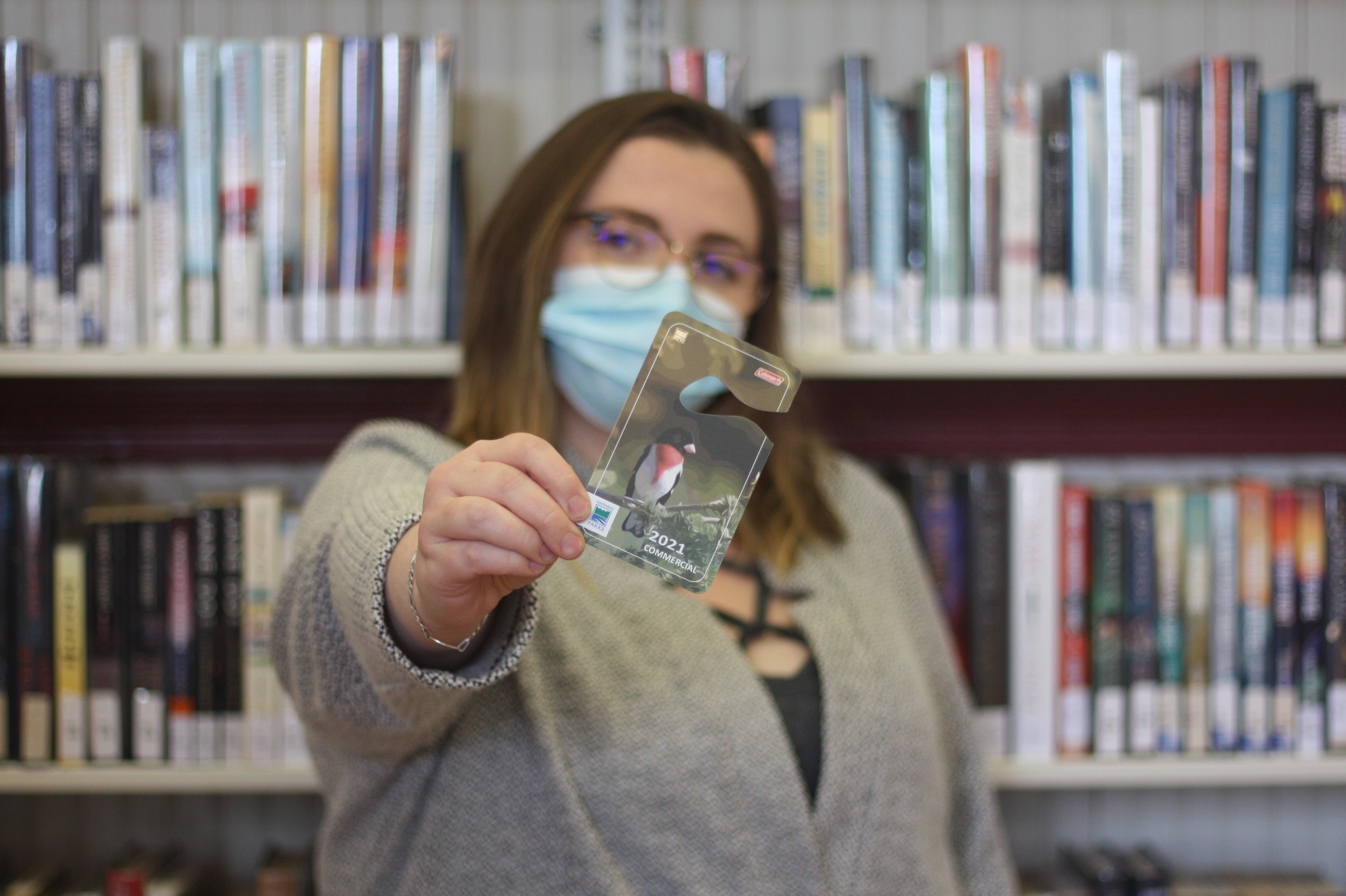 Branch Assistant Leena Bourne holds an Ontario Parks Pass