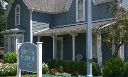 Front of a blue house.