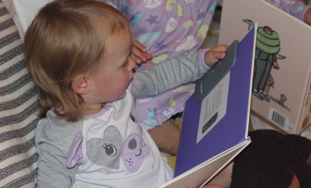 Girl reading a book.