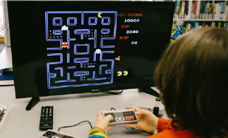 Children playing a video game. 