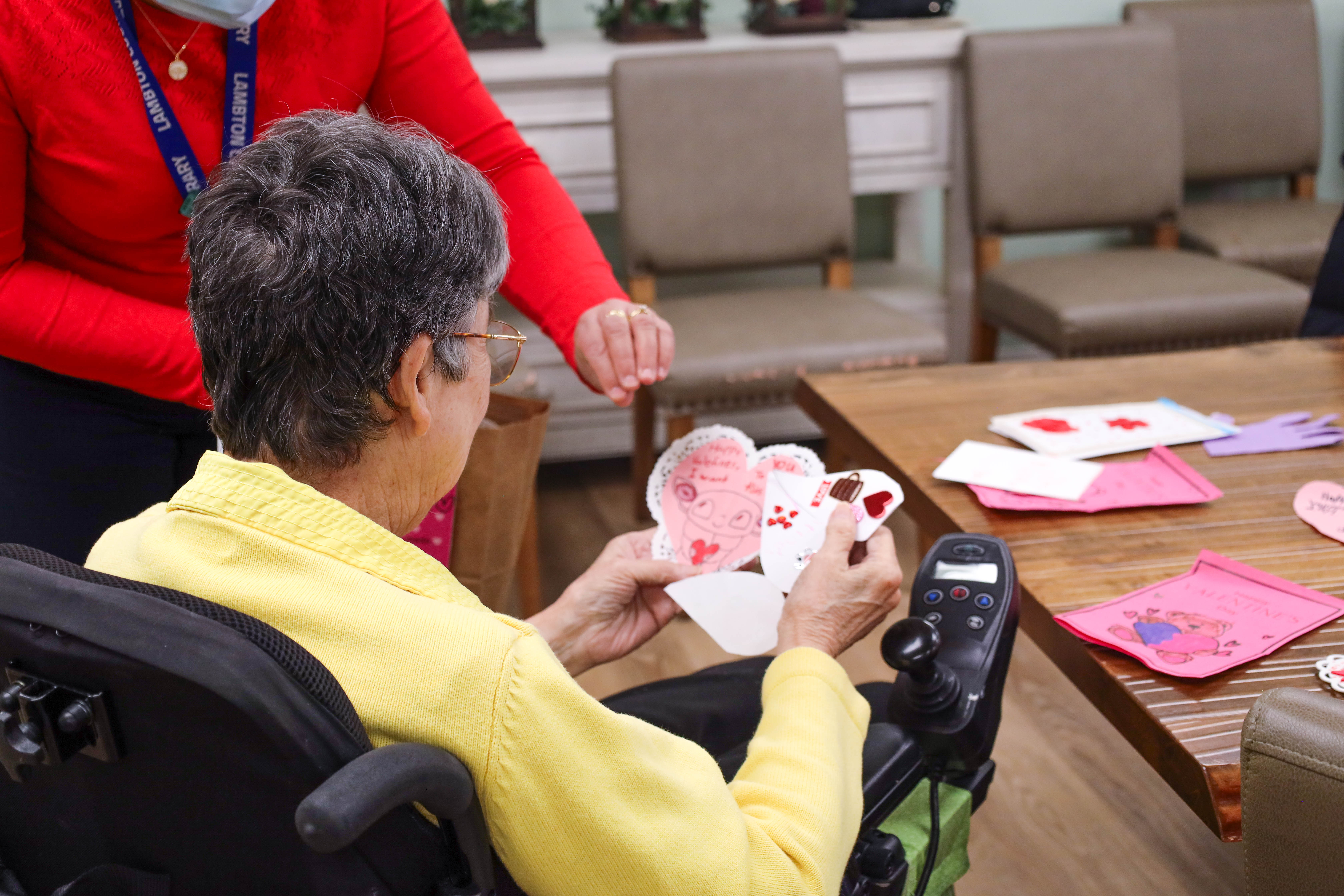 A resident at Lambton Meadowview Villa receives handmade cards from Lambton County Library's Valentine's for Long-Term Care initiative