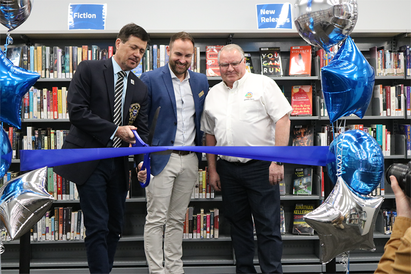 Lambton County Warden Kevin Marriott, County of Lambton General Manager of Cultural Services Andrew Meyer, and Lambton Shores Mayor Bill Weber cut the ceremonial ribbon at the re-opening celebration for the Forest Library on Tuesday, May 3.