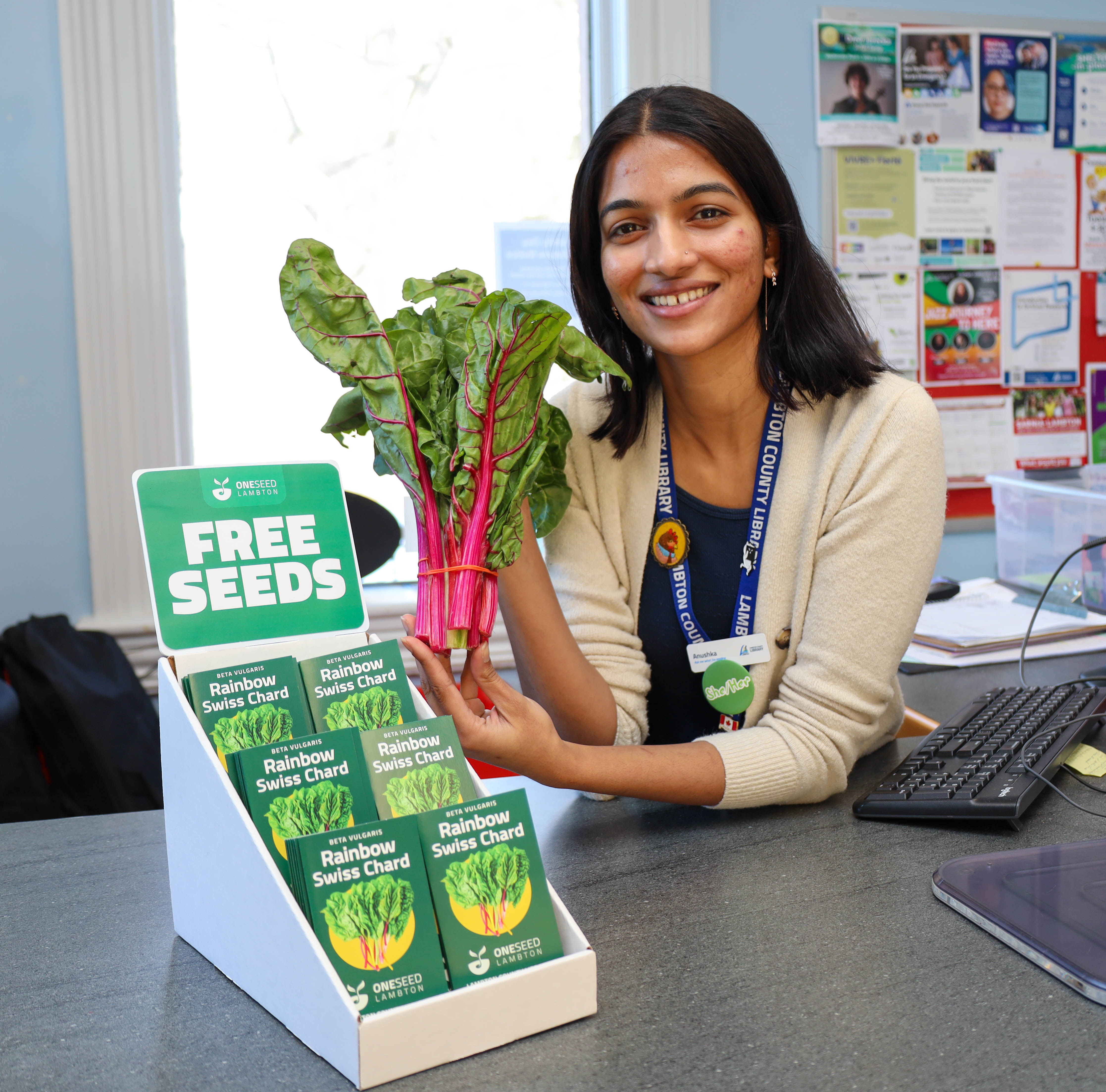 Anushka Pokle, Lambton County Library Branch Assistant, displays this year’s One Seed Lambton selection, Rainbow Swiss Chard, at Bright’s Grove Library.