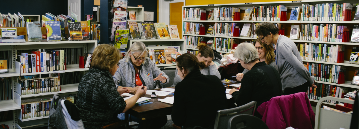 Adults in a workshop.