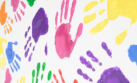 painted hand prints in many colours.