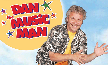 White male with grey hair waving, with Dan the Music man logo in the background.