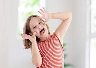 Young girl making a silly face.