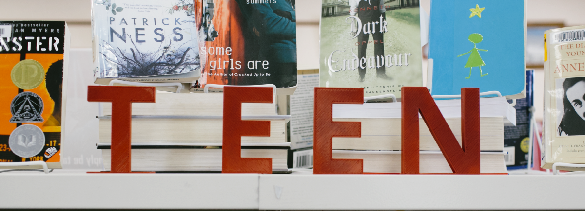 Word teen on top of a bookshelf.