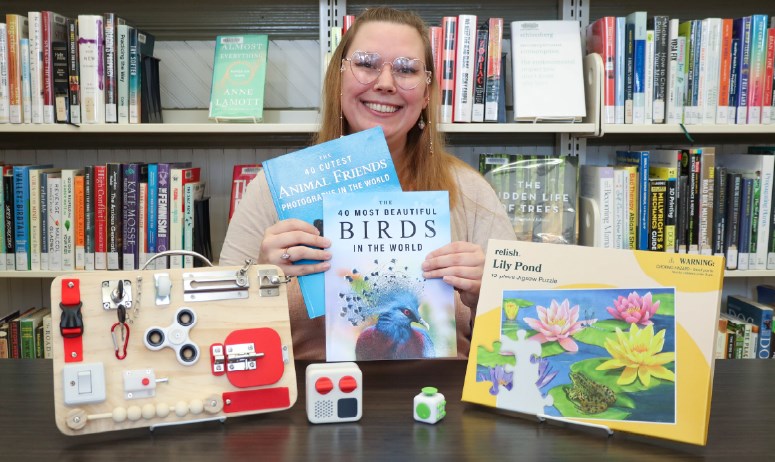  Branch assistant April Fresh presents items from a new Memory Care Kit