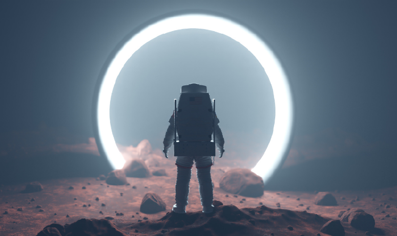 Astronaut stands on a rocky surface looking into a glowing doorway.