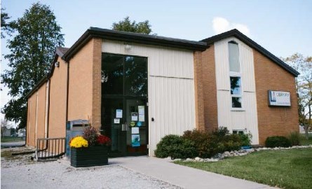 Front of red and white brick building.