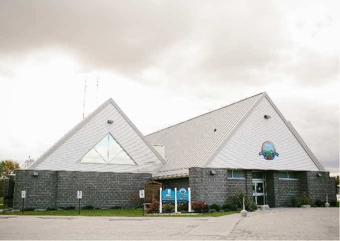 Grey and white brick building. 