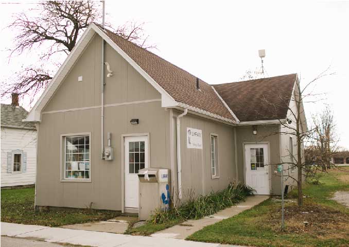 Small beige building. 